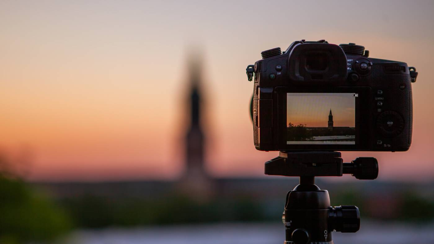 professional video camera shooting sunset